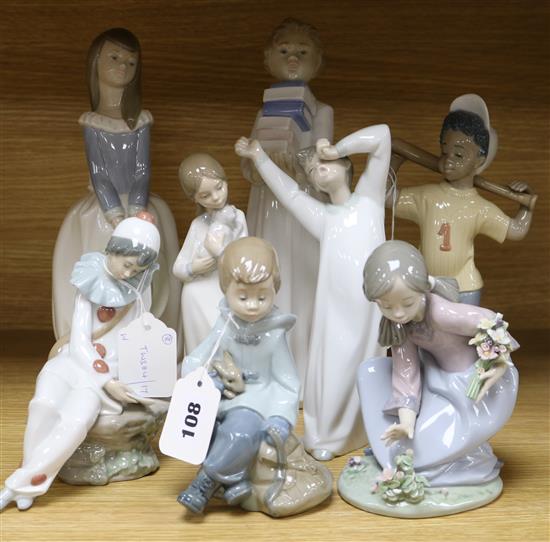 A collection of eight Lladro and Nao figures, Tallest H.28cm